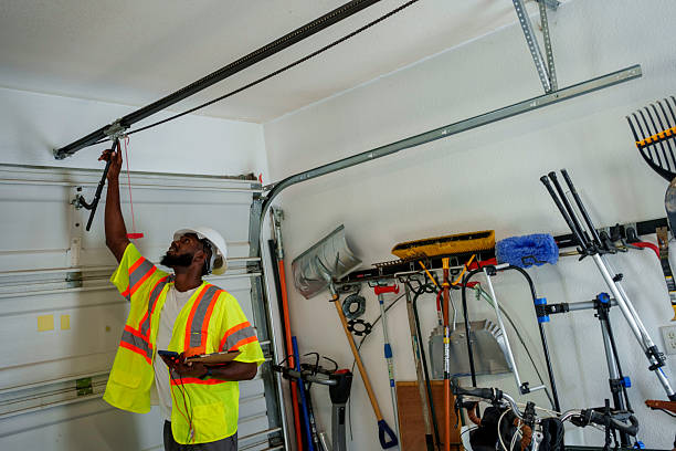 Professional Garage Door Panel Replacement technician working in Canastota, NY